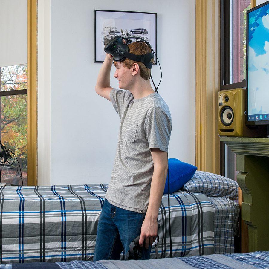 Student using VR headset in their dorm